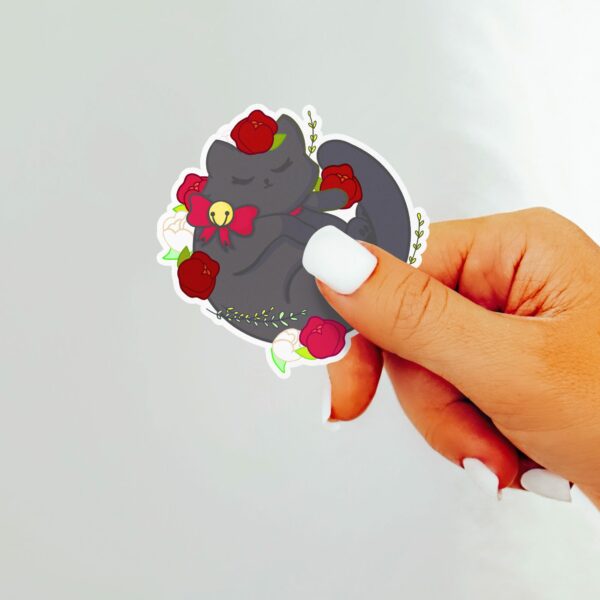 This image shows an hand-drawn adorable sticker, Floral Black Cat Sticker, which is available to purchase from HunnieByte.com