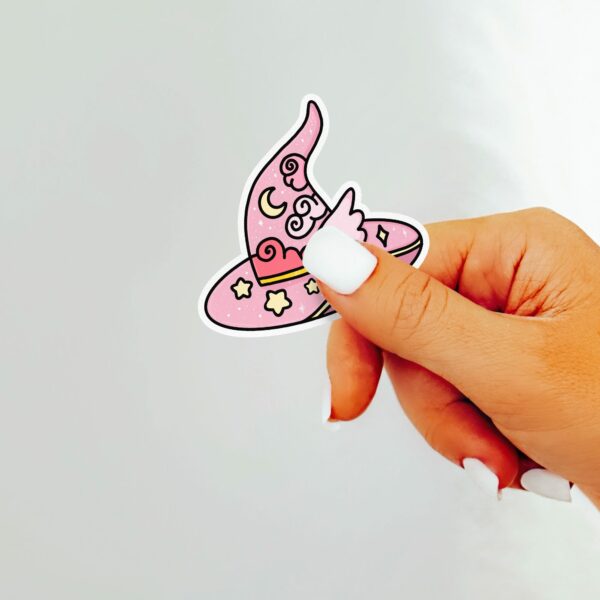 This image shows an hand-drawn adorable sticker, Pretty Pink Magical Hat Sticker, which is available to purchase from HunnieByte.com