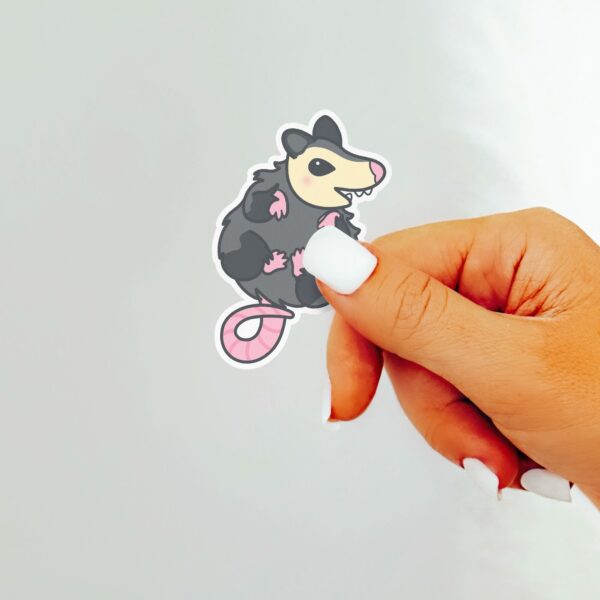 This image shows an hand-drawn adorable sticker, Squishy Possum Baby Sticker, which is available to purchase from HunnieByte.com