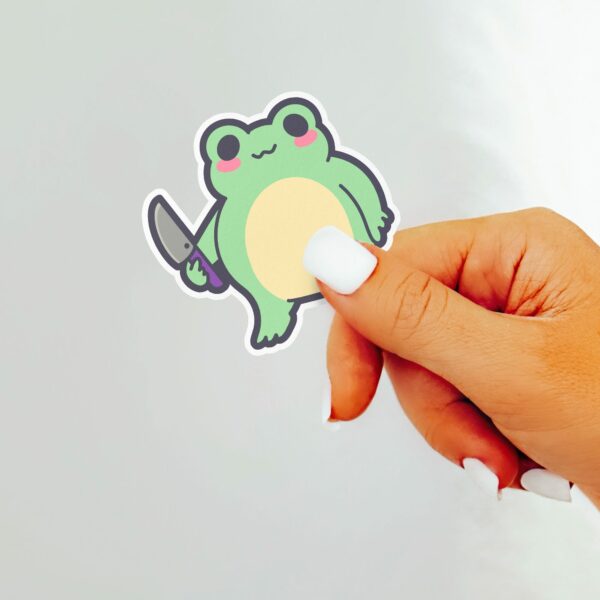 This image shows an hand-drawn adorable sticker, Sus Frog Boy Sticker, which is available to purchase from HunnieByte.com