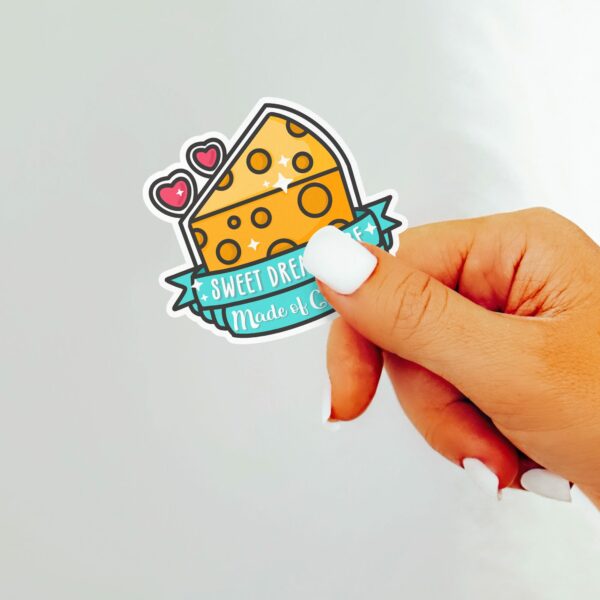 This image shows an hand-drawn adorable sticker, Sweet Dreams Are Made Of Cheese Sticker, which is available to purchase from HunnieByte.com