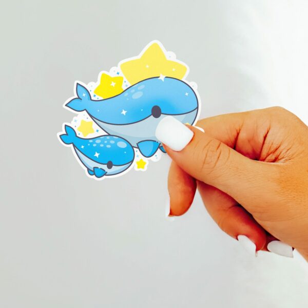 This image shows an hand-drawn adorable sticker, Whale Family Sticker, which is available to purchase from HunnieByte.com