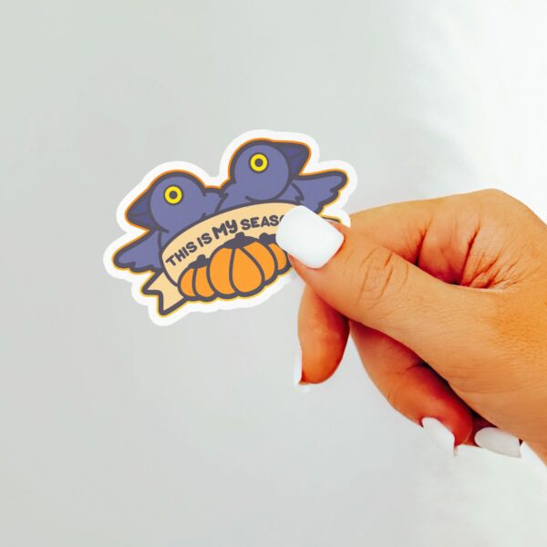 This image shows an hand-drawn adorable sticker, This Is My Season Crow Sticker, which is available to purchase from HunnieByte.com