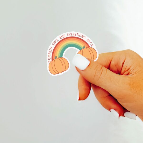 This image shows an hand-drawn adorable sticker, Pumpkin Spice Rainbow Sticker, which is available to purchase from HunnieByte.com