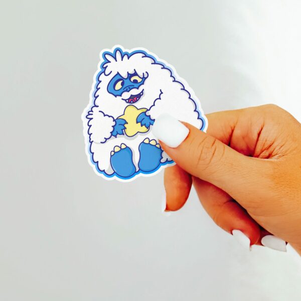 This image shows an hand-drawn adorable sticker, Derpy Yeti Star Sticker, which is available to purchase from HunnieByte.com