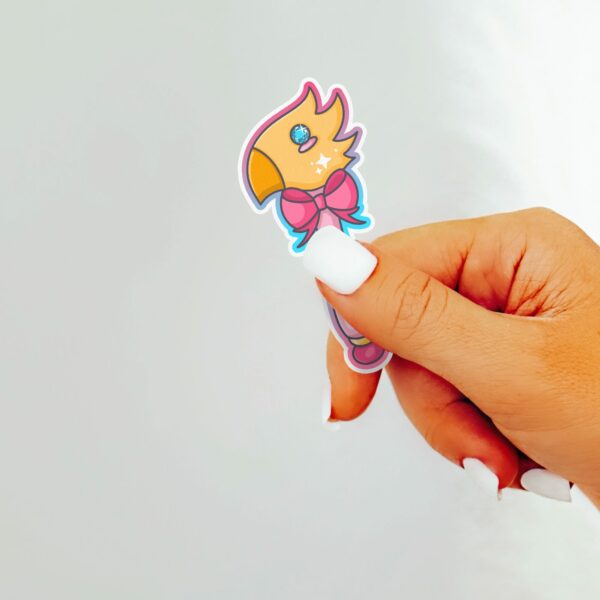 This image shows an hand-drawn adorable sticker, Magical Avian Wand Sticker, which is available to purchase from HunnieByte.com