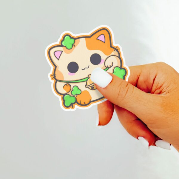 This image shows an hand-drawn adorable sticker, Lucky Calico Cat Sticker, which is available to purchase from HunnieByte.com