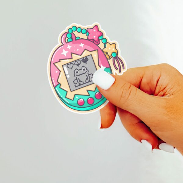 This image shows an hand-drawn adorable sticker, Pet Frog Game Sticker, which is available to purchase from HunnieByte.com