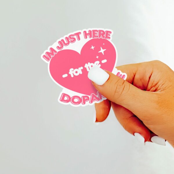 This image shows our adorable sticker finishes, Im Just Here For The Dopamine Sticker, which is available to purchase from HunnieByte.com