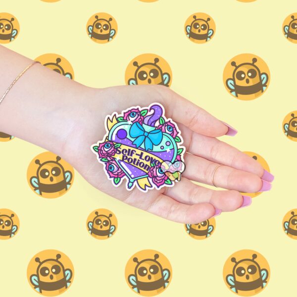 This image shows our adorable sticker finishes, Self Love Potion Sticker, which is available to purchase from HunnieByte.com