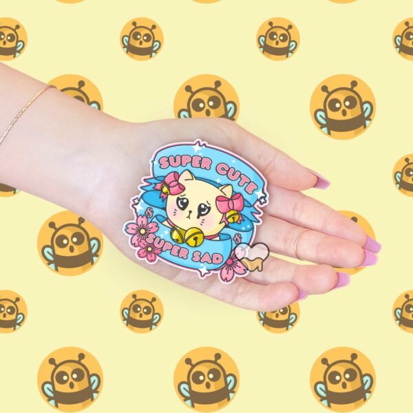 This image shows our adorable sticker finishes, Super Cute Super Sad Kitty Sticker, which is available to purchase from HunnieByte.com