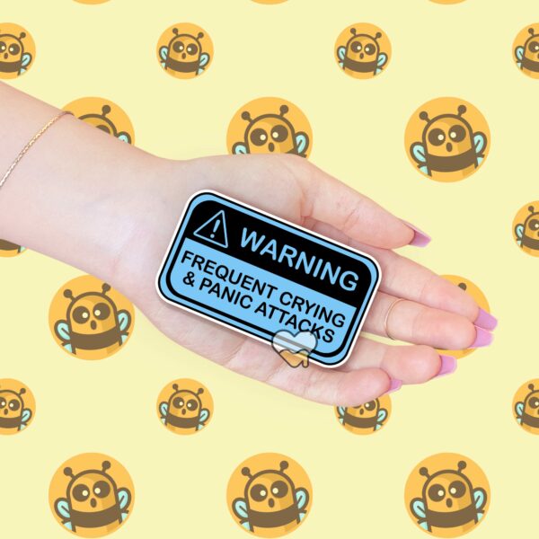 This image shows our adorable sticker finishes, Warning Frequent Panic Attacks Sticker, which is available to purchase from HunnieByte.com