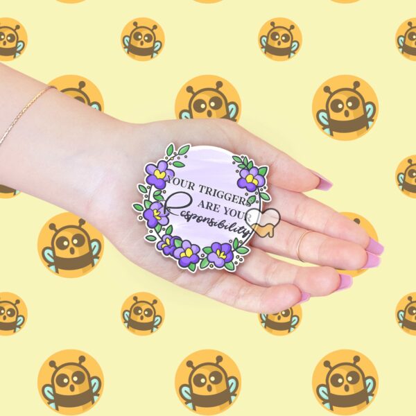 This image shows our adorable sticker finishes, Your Triggers Are Your Responsibility Sticker, which is available to purchase from HunnieByte.com