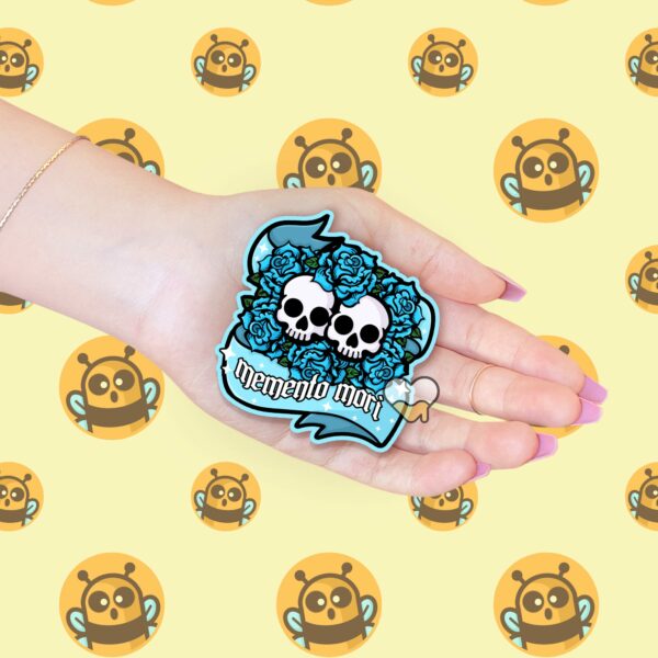 This image shows our adorable sticker finishes, Memento Mori Sticker, which is available to purchase from HunnieByte.com