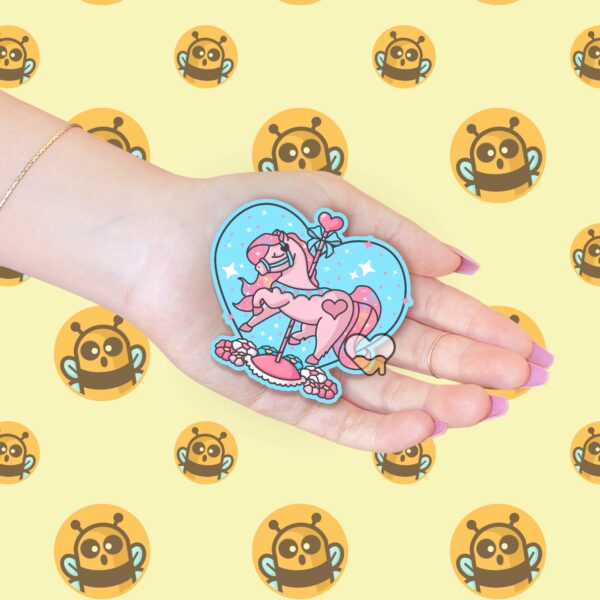 This image shows an hand-drawn adorable sticker, Carousel Horse Twinkle Heart Sticker, which is available to purchase from HunnieByte.com