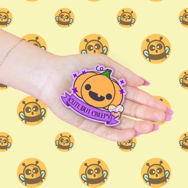 This image shows an hand-drawn adorable sticker, Cute But Creepy Pumpkin Sticker, which is available to purchase from HunnieByte.com