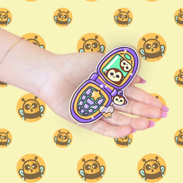 This image shows an hand-drawn adorable sticker, Flip Phone Fun Monkey Friend, which is available to purchase from HunnieByte.com