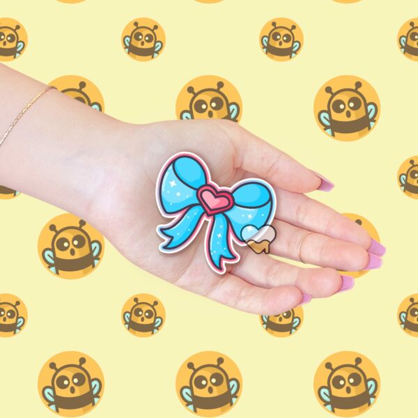 This image shows an hand-drawn adorable sticker, Magical Girl Heart Bow Sticker, which is available to purchase from HunnieByte.com