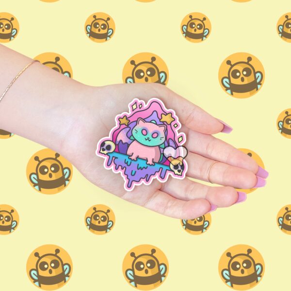 This image shows our adorable sticker finishes, Creepy Dripping Kitty Sticker, which is available to purchase from HunnieByte.com