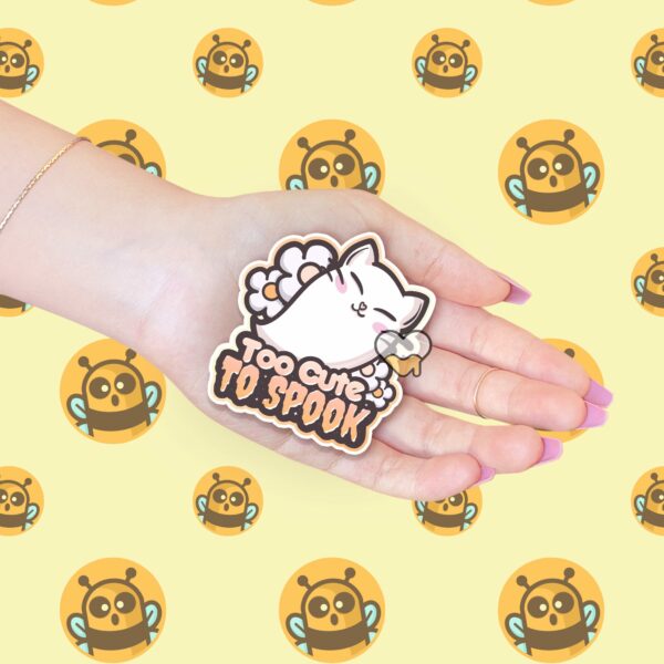 This image shows an hand-drawn adorable sticker, Too Cute To Spook Sticker, which is available to purchase from HunnieByte.com