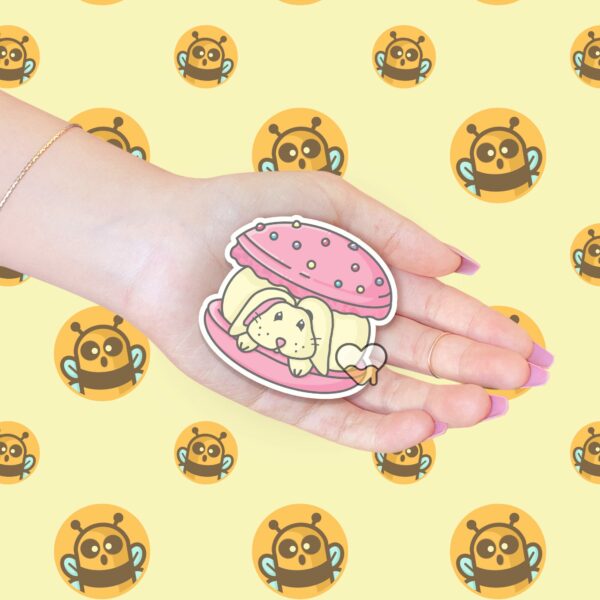 This image shows an hand-drawn adorable sticker, Bunny Macaroon Sticker, which is available to purchase from HunnieByte.com