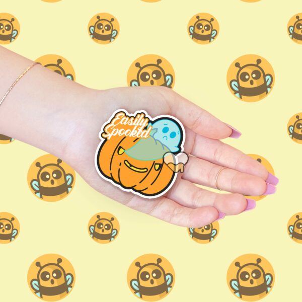 This image shows an hand-drawn adorable sticker, Easily Spooked Ghost Sticker, which is available to purchase from HunnieByte.com