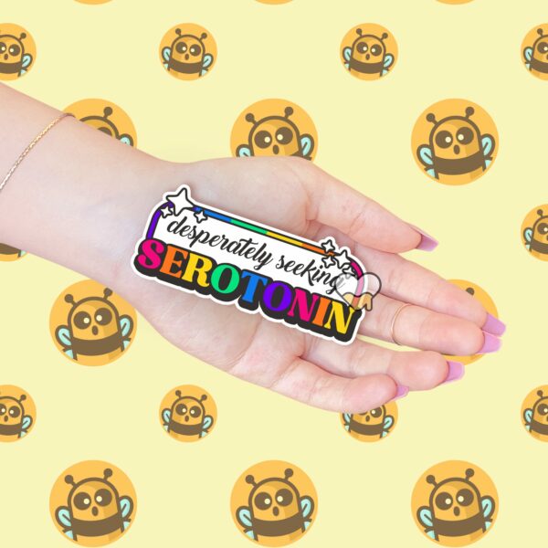 This image shows our adorable sticker finishes, Desperately Seeking Serotonin Sticker, which is available to purchase from HunnieByte.com