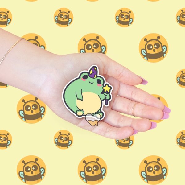 This image shows an hand-drawn adorable sticker, Magical Frog Boi Sticker, which is available to purchase from HunnieByte.com