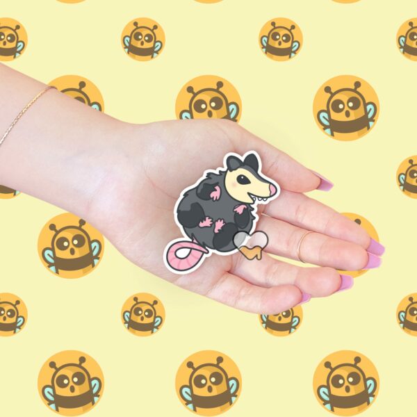 This image shows an hand-drawn adorable sticker, Squishy Possum Baby Sticker, which is available to purchase from HunnieByte.com