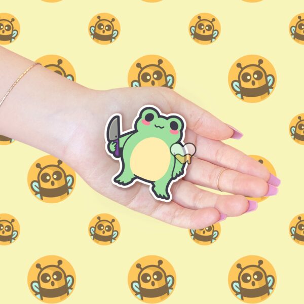 This image shows an hand-drawn adorable sticker, Sus Frog Boy Sticker, which is available to purchase from HunnieByte.com