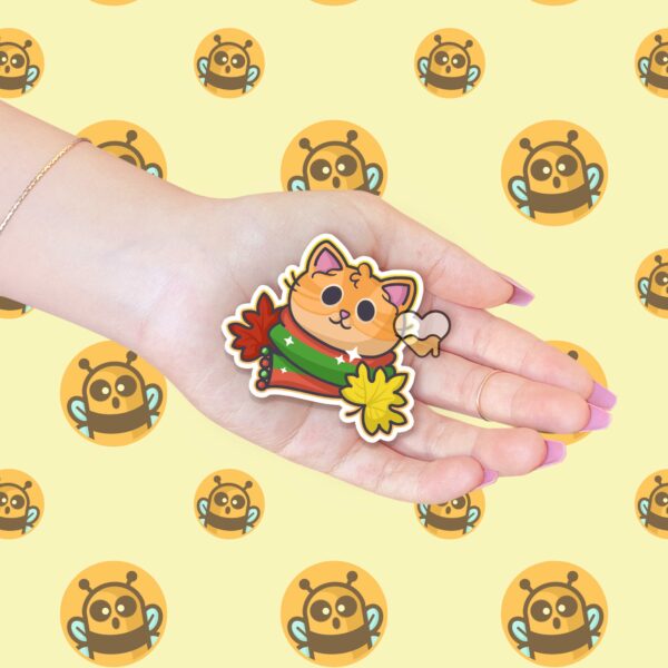 This image shows an hand-drawn adorable sticker, Autumn Ginger Kitty Sticker, which is available to purchase from HunnieByte.com