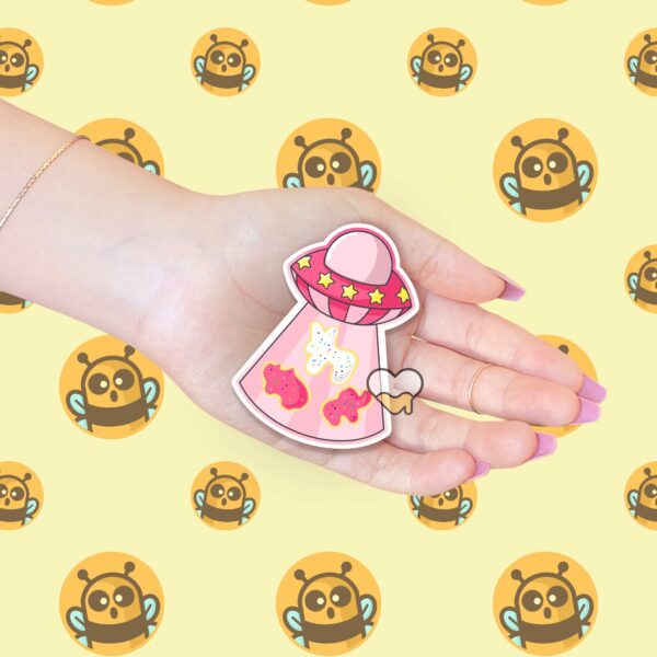 This image shows an hand-drawn adorable sticker, UFO Animal Cookie Sticker, which is available to purchase from HunnieByte.com