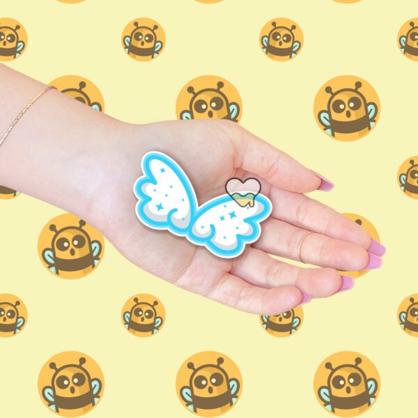 This image shows an hand-drawn adorable sticker, Cute Cloud Wings Sticker, which is available to purchase from HunnieByte.com