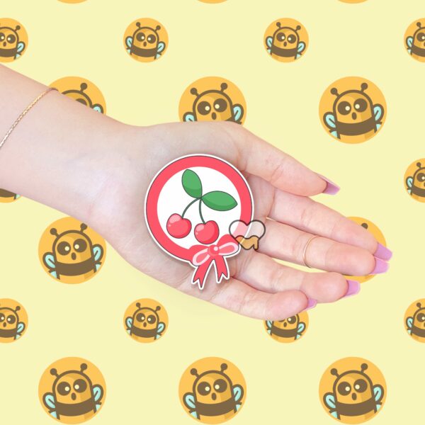 This image shows an hand-drawn adorable sticker, Pink Cherry Bow Sticker, which is available to purchase from HunnieByte.com