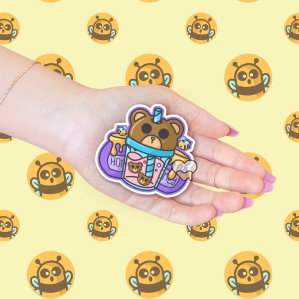 This image shows an hand-drawn adorable sticker, Bear Honey Juice Sticker, which is available to purchase from HunnieByte.com