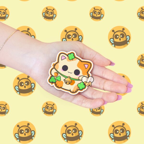 This image shows an hand-drawn adorable sticker, Lucky Calico Cat Sticker, which is available to purchase from HunnieByte.com