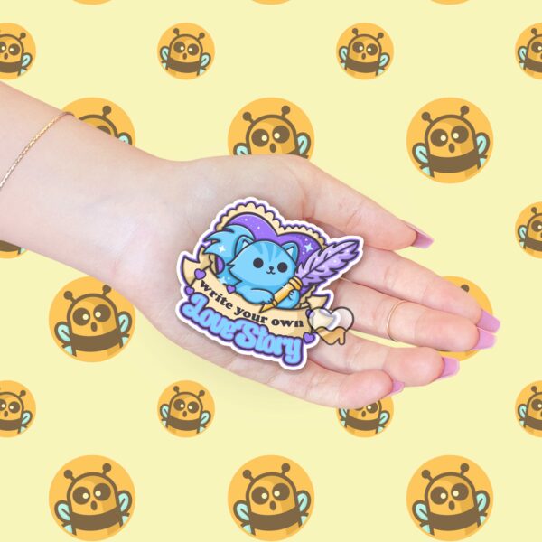 This image shows an hand-drawn adorable sticker, Write Your Own Love Story Sticker, which is available to purchase from HunnieByte.com