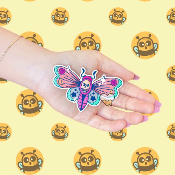 This image shows our adorable sticker finishes, Pastel Deaths Head Moth Sticker, which is available to purchase from HunnieByte.com