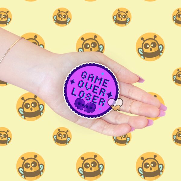 This image shows our adorable sticker finishes, Game Over Loser Sticker, which is available to purchase from HunnieByte.com