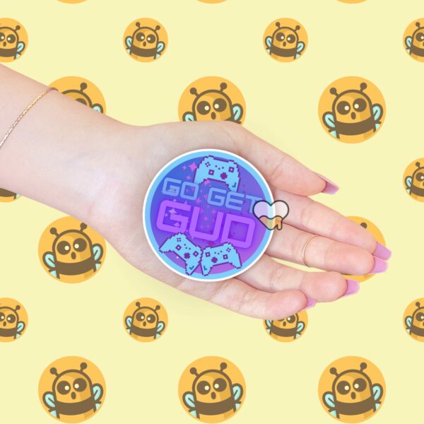 This image shows our adorable sticker finishes, Go Get Gud Gamer Sticker, which is available to purchase from HunnieByte.com