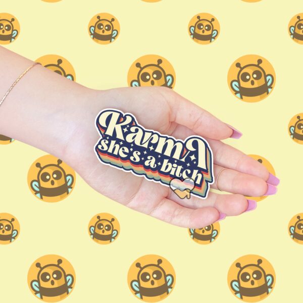 This image shows our adorable sticker finishes, Retro Karma Shes A Bitch Sticker, which is available to purchase from HunnieByte.com