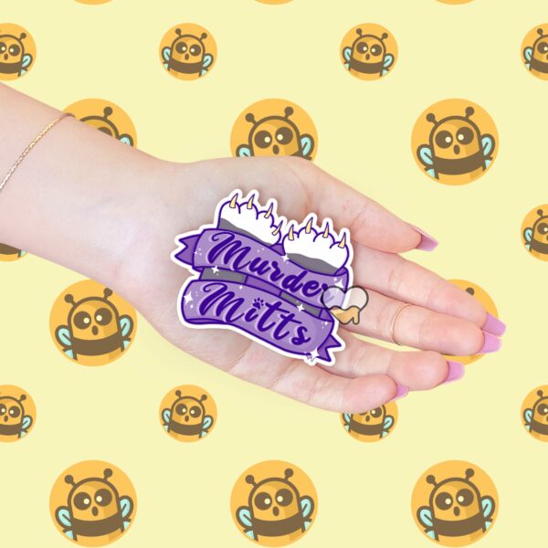 This image shows our adorable sticker finishes, Murder Mitts Sticker, which is available to purchase from HunnieByte.com