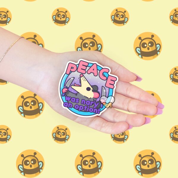 This image shows our adorable sticker finishes, Peace Was Nary An Option Possum Sticker, which is available to purchase from HunnieByte.com