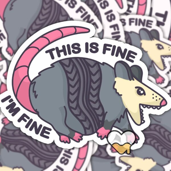 This image shows our adorable sticker finishes, This Is Fine Im Fine Possum Sticker, which is available to purchase from HunnieByte.com