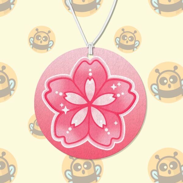 This image shows a hand-drawn adorable air freshener, Sakura Flower Air Freshener, which is available to purchase from HunnieByte.com