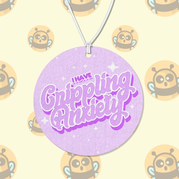 This image shows a hand-drawn adorable air freshener, I Have Crippling Anxiety Purple Air Freshener, which is available to purchase from HunnieByte.com