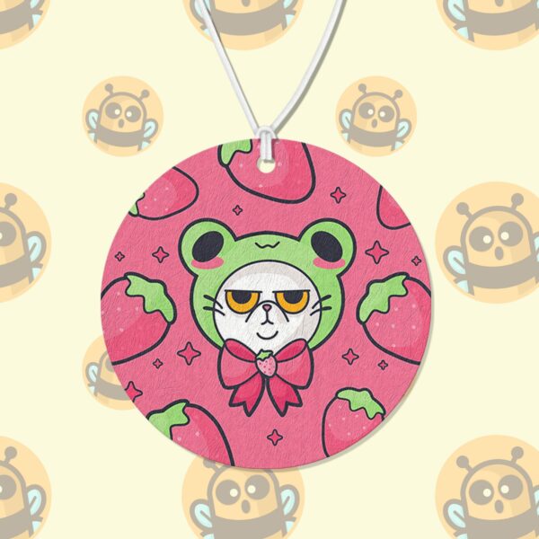 This image shows a hand-drawn adorable air freshener, Grumpy Strawberry Cat Air Freshener, which is available to purchase from HunnieByte.com