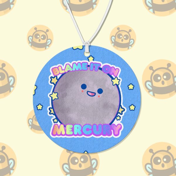 This image shows an adorable hand-drawn air freshener, Blame It On Mercury Air Freshener, which is available to purchase from HunnieByte.com