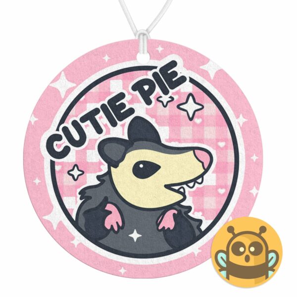 This image shows an adorable hand-drawn air freshener, Cutie Pie Possum Air Freshener, which is available to purchase from HunnieByte.com