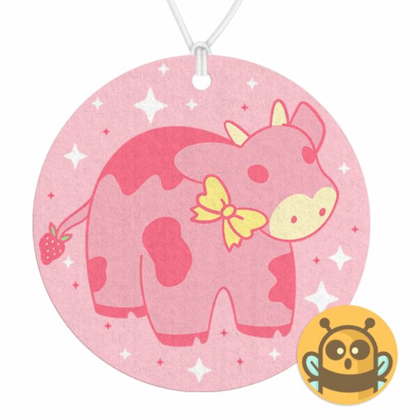 This image shows a hand-drawn adorable air freshener, Strawberry Cow Air Freshener, which is available to purchase from HunnieByte.com